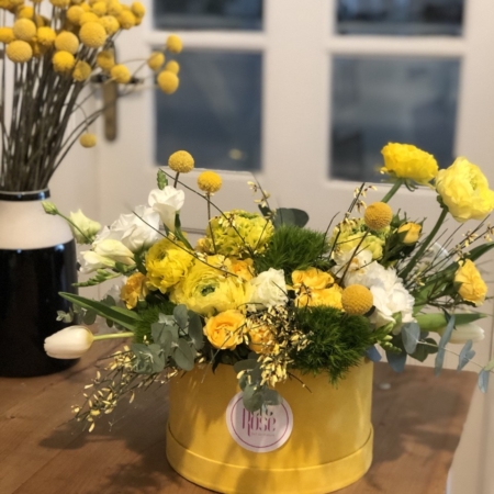 cutie cu flori galbene Rază de soare